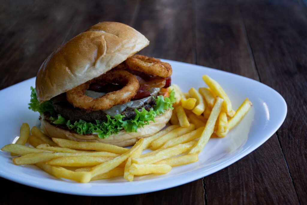 Chips of fries and a hambuger on a plate Businesses to Start With 20k in Kenya